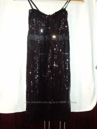 Продам эксклюзивное молодежное платье черного цвета с поетками 44 размера